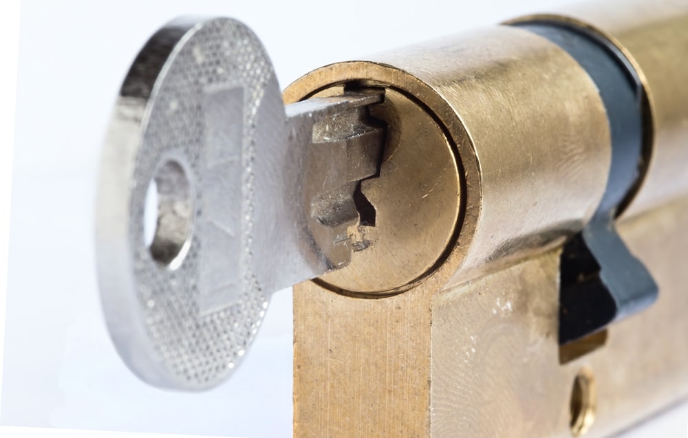 Detail of the key and plug - locked - cylinder lock - under lock and key - sense of security